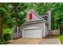 Charming home featuring a two-car garage and vibrant red window accent at 8 Wexford Dr, Durham, NC 27713