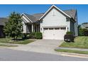 Beautiful two-story home with a two-car garage, lush lawn, and tasteful landscaping at 8461 Lentic Ct, Raleigh, NC 27615