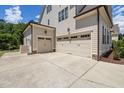 Spacious three-car garage with ample parking space and neutral-colored exterior, offering convenience and functionality at 937 Sedgefield Park Ln, Cary, NC 27519