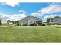 Expansive backyard featuring a well-maintained lawn and lovely landscaping at 95 Live Oak Dr, Louisburg, NC 27549