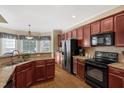Well-appointed kitchen with stainless steel appliances and granite countertops at 95 Live Oak Dr, Louisburg, NC 27549