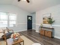 Cozy living room with modern flooring, stylish decor, and ample natural light at 1015 E Maplewood, Benson, NC 27504
