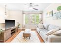 Cozy living room with natural light and comfortable sofa at 1028 Summerhouse Rd, Cary, NC 27519