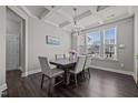 Elegant dining room with coffered ceilings, chandelier, and large windows at 1042 Cardross St, Burlington, NC 27215