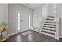 Inviting entryway features stylish flooring, a staircase, and plenty of natural light at 1042 Cardross St, Burlington, NC 27215