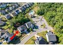 Aerial shot of property highlighting its location within a neighborhood and proximity to the community pool at 105 Blue Prince Trl, Holly Springs, NC 27540