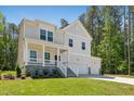Charming two-story home with a welcoming front porch and a two-car garage at 110 Cribbs Ln, Middlesex, NC 27557