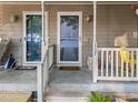 Welcoming front entrance featuring dual doors, decorative lights, and well-kept porch at 117 Candace Pl, Cary, NC 27513