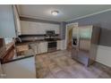 Updated kitchen with stainless steel appliances, ample counter space, and modern finishes at 1509 Logan St, Durham, NC 27704