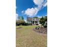 Traditional brick home with a well-kept lawn, beautiful flowers, and a two-car garage at 151 Donnibrook, Fuquay Varina, NC 27526