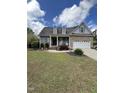 Well-maintained lawn enhances this charming home's curb appeal and invites you inside at 151 Donnibrook, Fuquay Varina, NC 27526