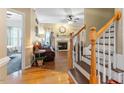 Welcoming foyer with hardwood floors and staircase leading to the upper level at 151 Donnibrook Run, Fuquay Varina, NC 27526