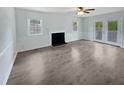 Living room with fireplace and sliding doors at 1522 Goodwin Rd, Durham, NC 27712