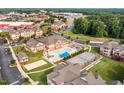 Aerial view of community featuring pool, tennis courts, and common areas at 168 Amber Acorn Ave, Raleigh, NC 27603