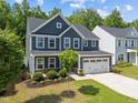 Attractive home with mature landscaping, a spacious two-car garage, and traditional design at 168 Amber Acorn Ave, Raleigh, NC 27603