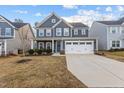 Beautiful two-story home with a well-manicured lawn and attached two-car garage at 168 Amber Acorn Ave, Raleigh, NC 27603