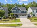 Beautiful two-story home featuring well-manicured lawn, two-car garage and traditional design at 168 Amber Acorn Ave, Raleigh, NC 27603