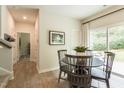 Dining area boasts a round table, four chairs, and sliding glass doors at 171 Alice Trace Place, Angier, NC 27501