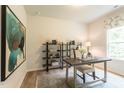 Home office features a modern desk, shelving, and natural light from a window at 171 Alice Trace Place, Angier, NC 27501