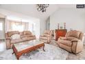Cozy living room with neutral tones, plush seating, and stylish decor at 1808 Betry Pl, Raleigh, NC 27603