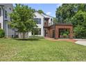 Lovely two-story house with white siding, modern wood features, and a spacious front yard at 1820 Park Dr, Raleigh, NC 27605