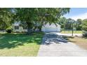 Beautiful home with a large front yard, two-car garage, and a basketball hoop on the driveway at 2717 Jack Rd, Clayton, NC 27520