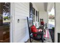 Close-up of a cozy front porch with rocking chairs, decorative pillows, and a welcoming ambiance at 2717 Jack Rd, Clayton, NC 27520
