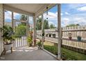 Relaxing screened porch with plants and outdoor seating at 2812 Prospect Pkwy, Durham, NC 27703