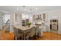 Bright, spacious kitchen with granite counters, stainless steel appliances, and hardwood floors at 300 Livingstone Dr, Cary, NC 27513