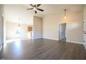 Spacious living room showing open floor plan to kitchen and high ceilings at 404 S Eastwood Dr, Benson, NC 27504