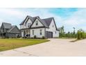 Attractive two-story home with a driveway leading to an attached two-car garage at 474 Pine Ridge Rd, Zebulon, NC 27597