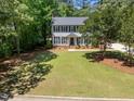 Inviting two-story home with expansive lawn and mature trees at 7204 Laketree Dr, Raleigh, NC 27615