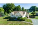 Inviting single-Gathering home with manicured lawn, mature trees, and long gravel driveway at 78 Cross Creek Ct, Timberlake, NC 27583