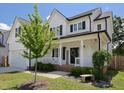 Beautiful two-story home boasting a lovely front porch, complemented by meticulous landscaping and curb appeal at 808 Trinity Park Dr, Wake Forest, NC 27587