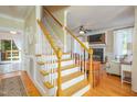 Entryway view with a staircase that flows into a living room with a fireplace at 8517 Falkirk Ridge Ct, Wake Forest, NC 27587