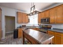 Spacious kitchen with stainless appliances, a kitchen island, and a gas range at 8517 Falkirk Ridge Ct, Wake Forest, NC 27587
