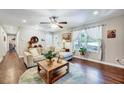 Cozy living room with hardwood floors, a large window, and stylish furniture at 9220 Old Cascade Dr, Garner, NC 27529