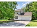Charming two-story home with a two-car garage and lush greenery in a well-maintained neighborhood at 105 Hiddenwood Ct, Garner, NC 27529
