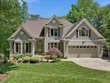 Charming two-story home with manicured landscaping and a convenient two-car garage at 105 Highlands Lake Dr, Cary, NC 27518