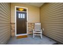Cozy front porch with a rocking chair creates a welcoming entrance to the home at 1101 Compass Dr, Durham, NC 27713