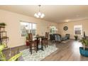 Bright living space with modern flooring, stylish furnishings, and ample natural light from large windows at 116 Laurel Ave, Durham, NC 27701