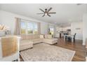 Open-concept living space shows living room, dining area, and kitchen with stainless appliances at 19 Cecina Ct, Clayton, NC 27527