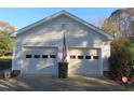 Spacious two-car detached garage with concrete driveway and automatic doors at 2000 Howson Rd, Raleigh, NC 27603
