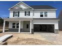 New construction home with white siding, stone accents, and an attached two-car garage at 241 Tidal Pool Way, Cary, NC 27519