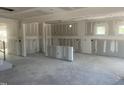 Unfinished room featuring drywall, concrete floor, and multiple outlets at 241 Tidal Pool Way, Cary, NC 27519