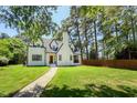 Inviting two-story home with manicured lawn, showcasing its classic design and curb appeal at 2515 W Club Blvd, Durham, NC 27705