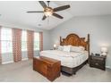 Spacious main bedroom features a ceiling fan, a large window and decorative brown curtains at 2605 Mcdougall Dr, Burlington, NC 27217
