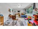 Bright playroom featuring durable flooring, ample windows for natural light, and organized storage at 2824 Blanche Dr, Burlington, NC 27215