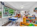 Spacious playroom filled with natural light, featuring durable floors and functional storage solutions at 2824 Blanche Dr, Burlington, NC 27215