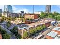An aerial view showcases the building in its city setting with visible city buildings and roads at 320 W Martin St # 205, Raleigh, NC 27601